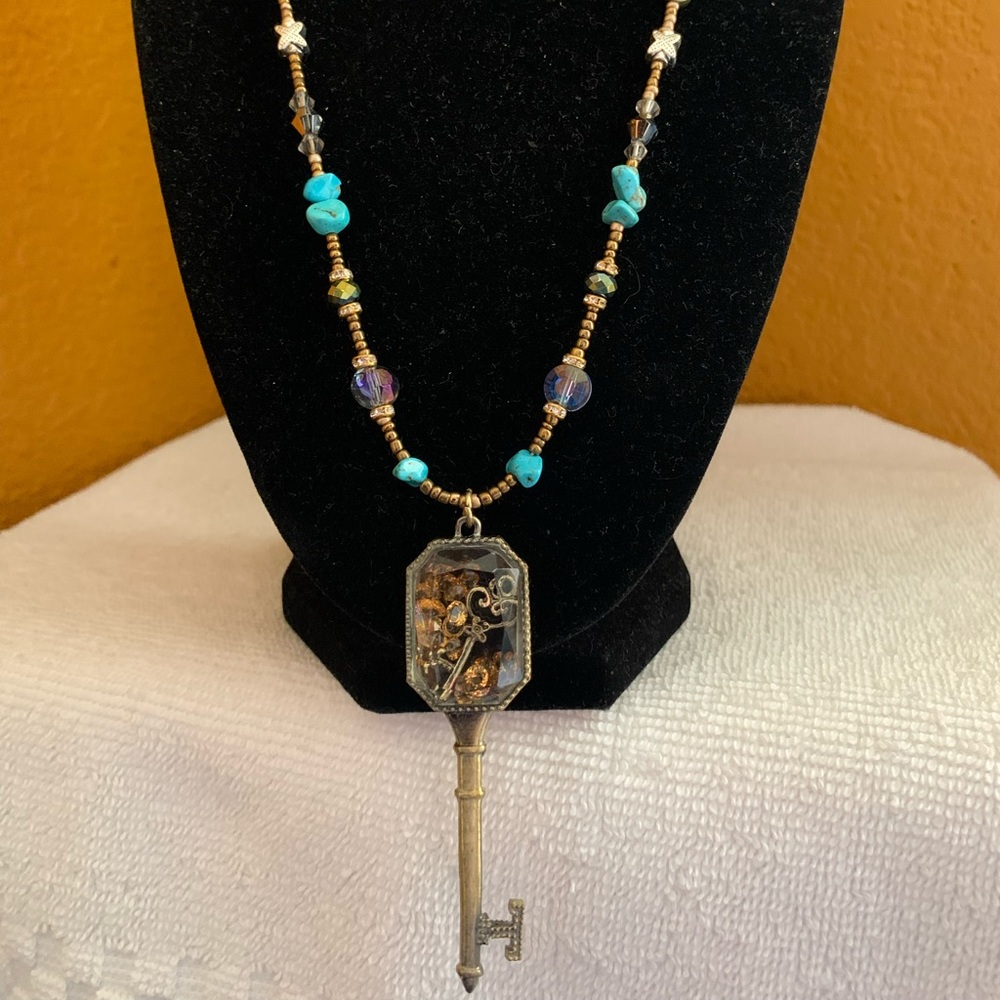 Beaded long necklace with gold key